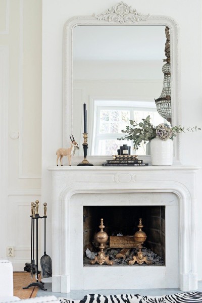 12315799-classic-mantelpiece-and-large-mirror-above-open-fireplace.jpg