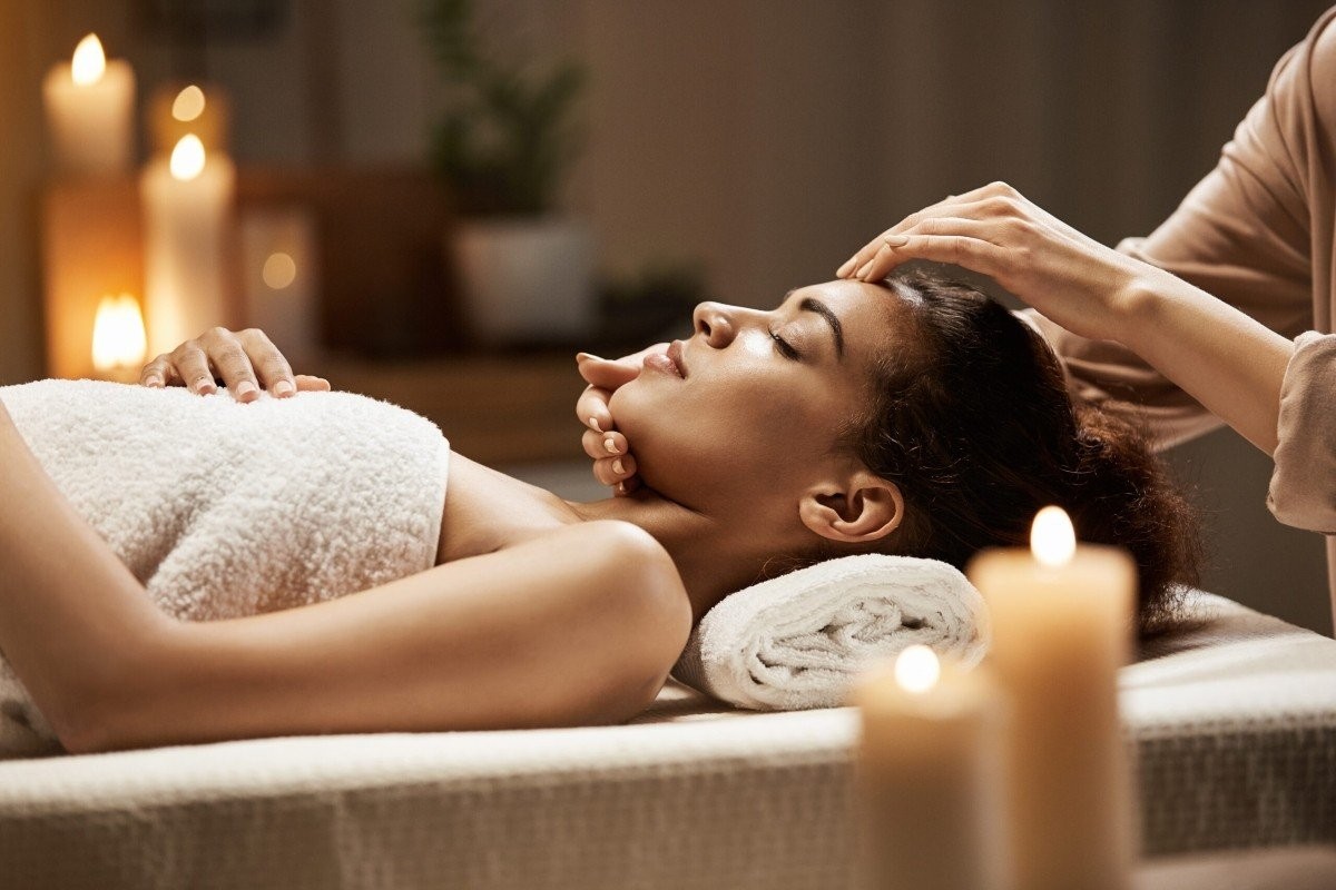 attractive-african-woman-enjoying-face-massage-spa-salon-scaled.jpg