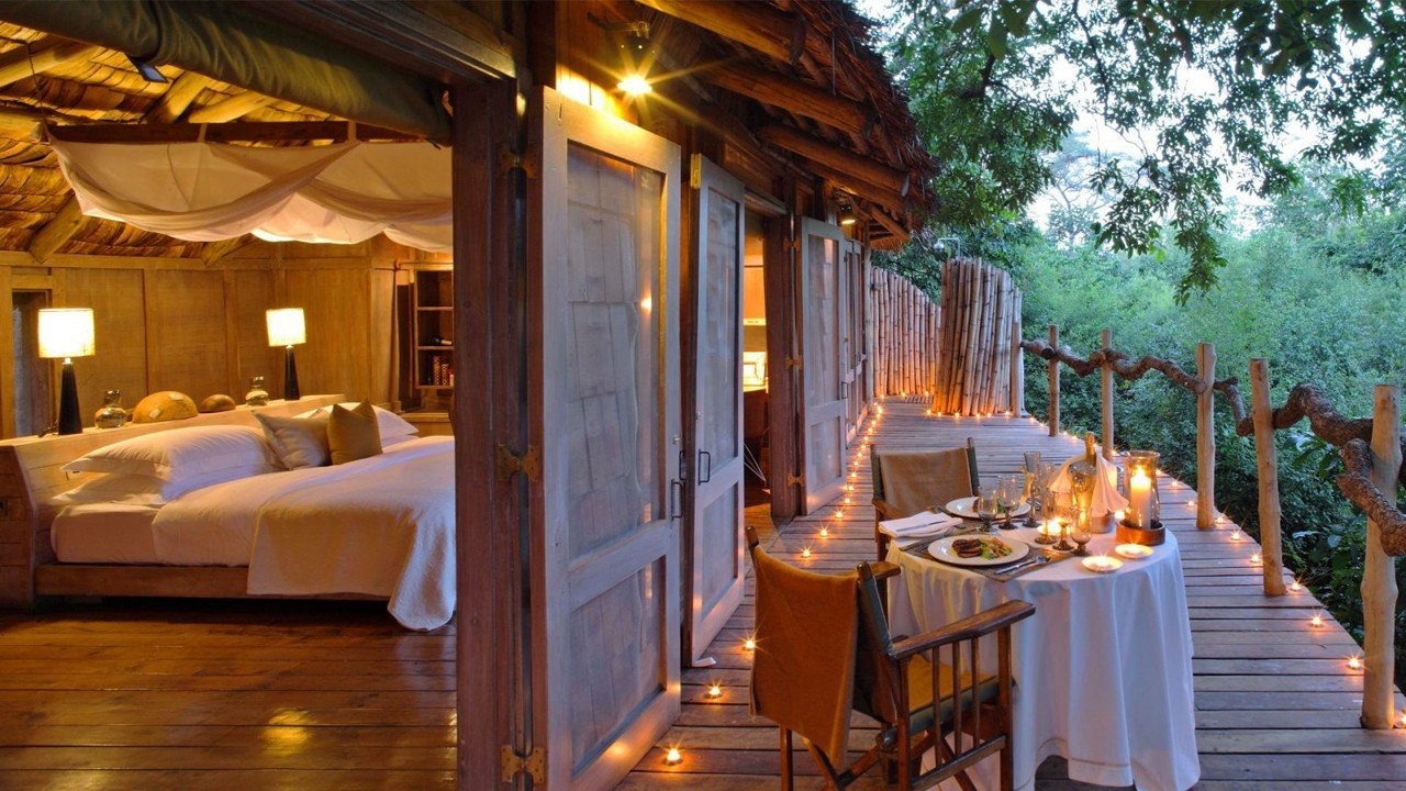 crelegant-bedrooms-with-generous-decks-and-forest-view-at-andbeyond-lake-manyara-lodge-on-a-tanzania-luxury-safari-1600x900-ztnmw.jpg