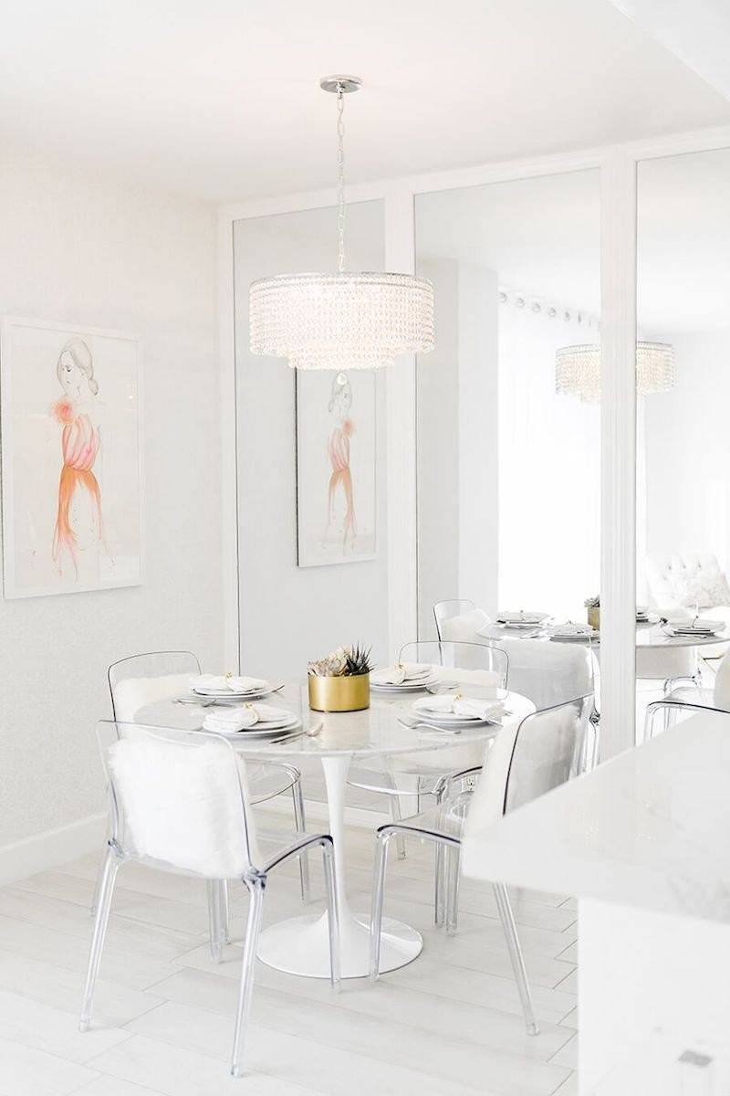 white-dining-room-with-crystal-chandelier-and-marble-tulip-table-via-sydne-summer.jpg