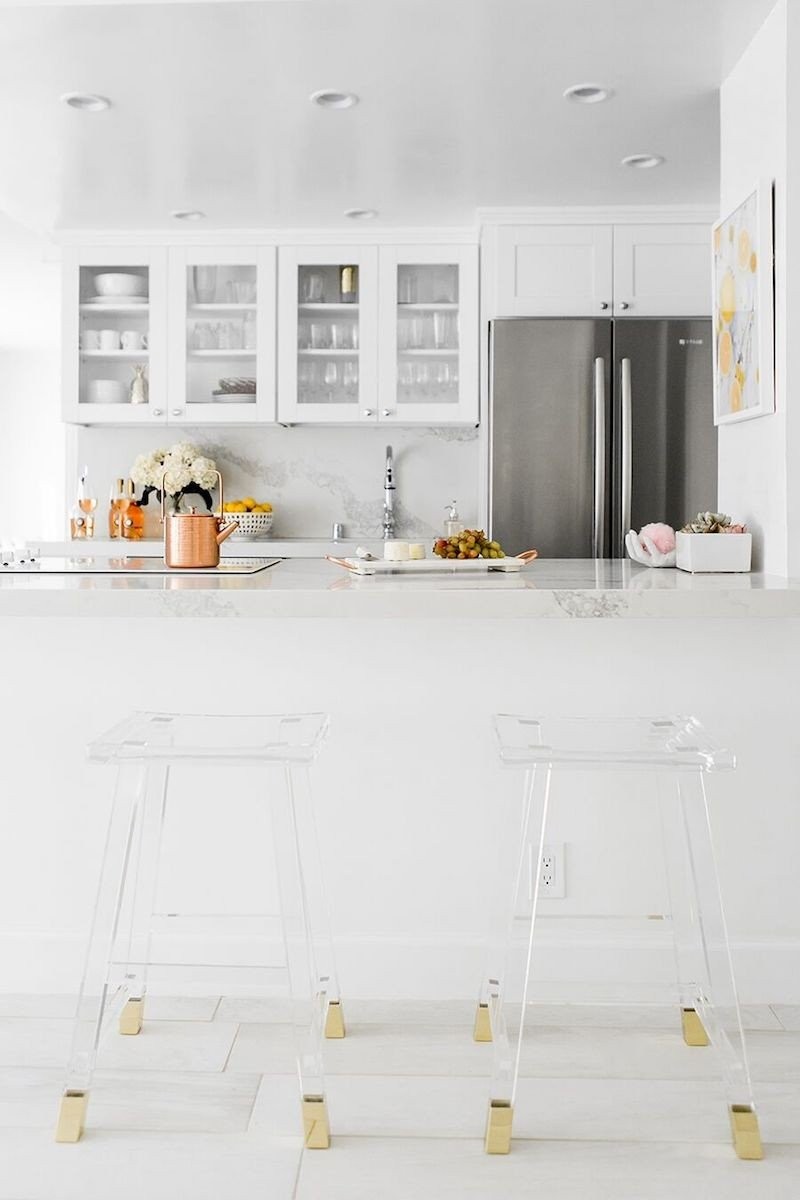 white-marble-kitchen-with-lucite-bar-stools-via-sydne-summer.jpg