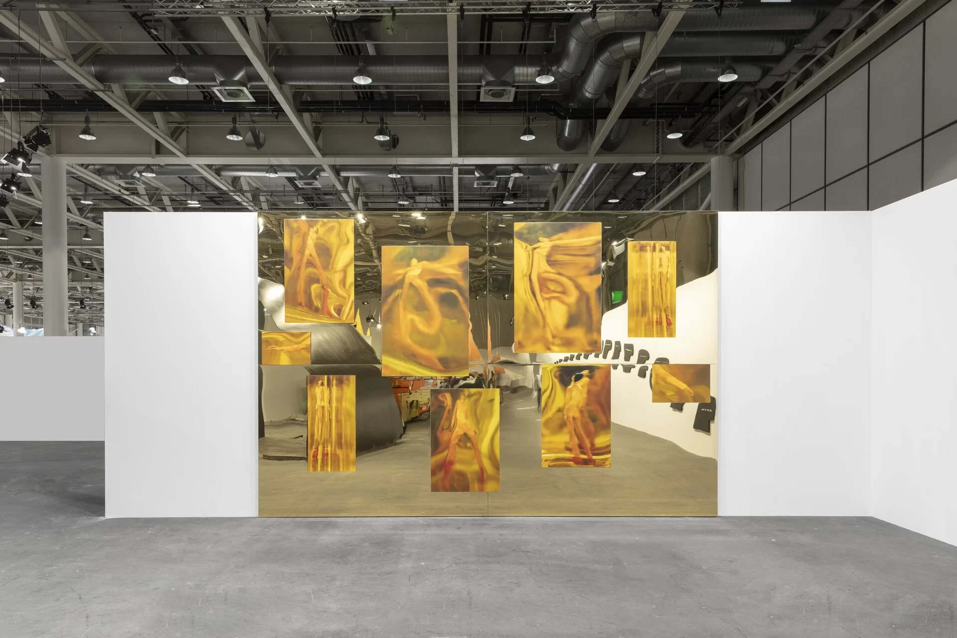 maria-hassabi-mirrors-2024-acrylic-gold-mirrors-with-9-photographs-mounted-on-aluminum-panel-wood-400-x-600-x-5-cm-installation-view-at-unlimited-basel-2024.webp