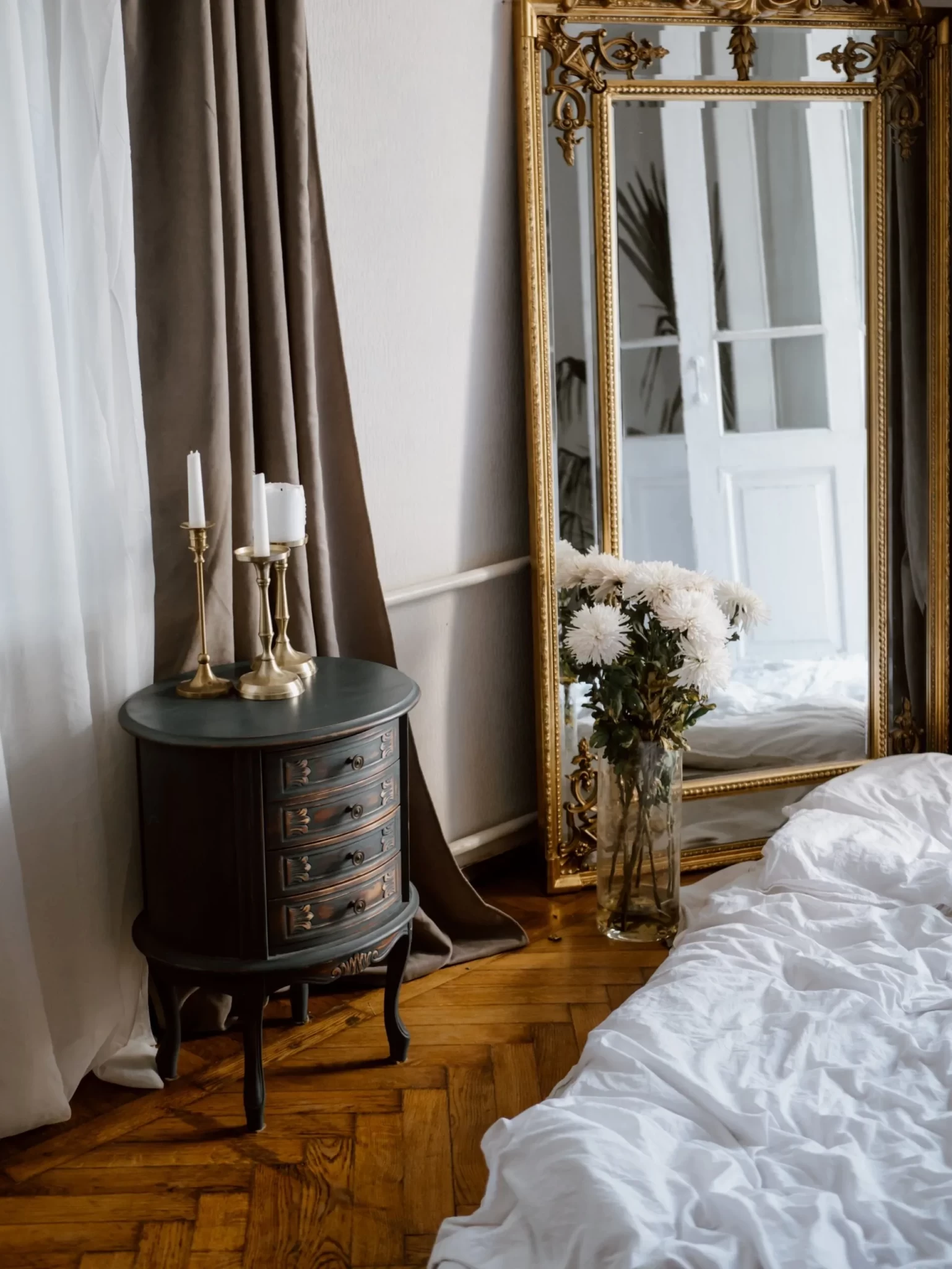 modern-paris-apartment-unmade-bed-puddling-curtains-mirror-on-floor-polina-kovaleva-for-pexels-scaled.webp