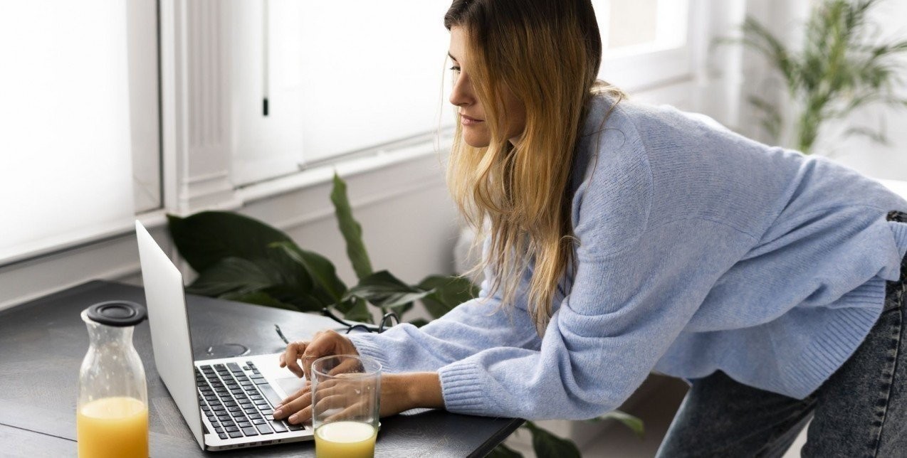 young-woman-using-laptop-at-home-royalty-free-image-1574848029.jpeg