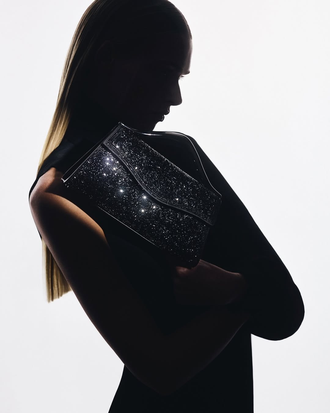 crafted-in-italy-this-piece-radiates-a-sense-of-structured-glamour-through-black-embellished-textures-and-a-sculpted-gunmetal-handle-an-emblem-of-refined-precisionshop-the-fall-winter-2025-handbag-collection.jpg