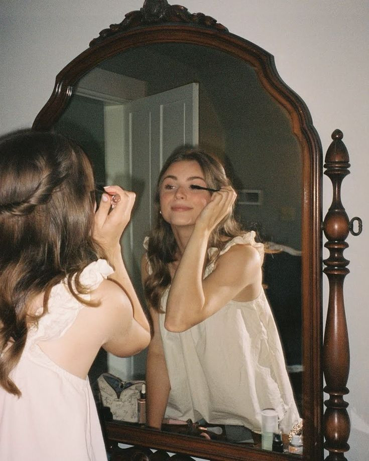 film-documentary-style-wedding-photos-bride-getting-ready-vintage-vanity-bride-doing-makeup-garden-wedding-inspiration-bride-getting-ready-ruffle-pajamas.jpg