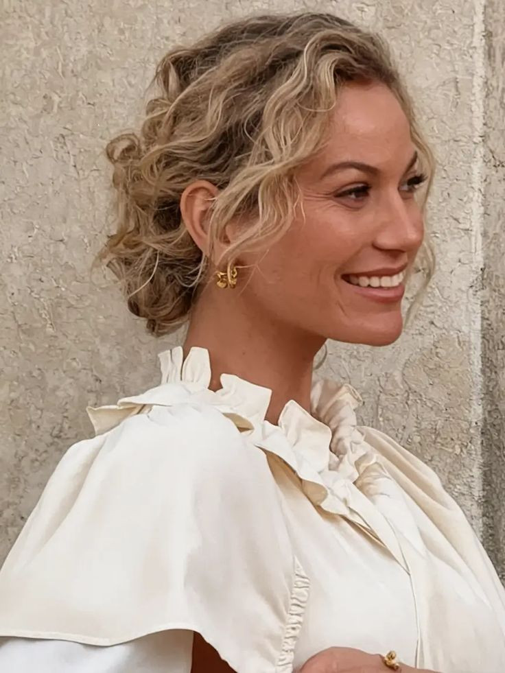 fall-haircut-ideas-for-september-2025-romantic-textured-chignon-with-curls.jpg