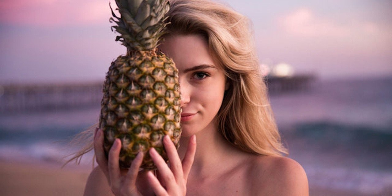 woman-beach-smiling-pineapple.jpg