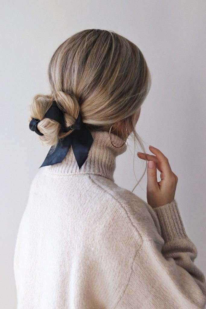 02-an-elegant-low-bun-interwoven-with-a-black-ribbon-is-a-very-chic-idea-suitable-for-many-bridal-styles.jpg