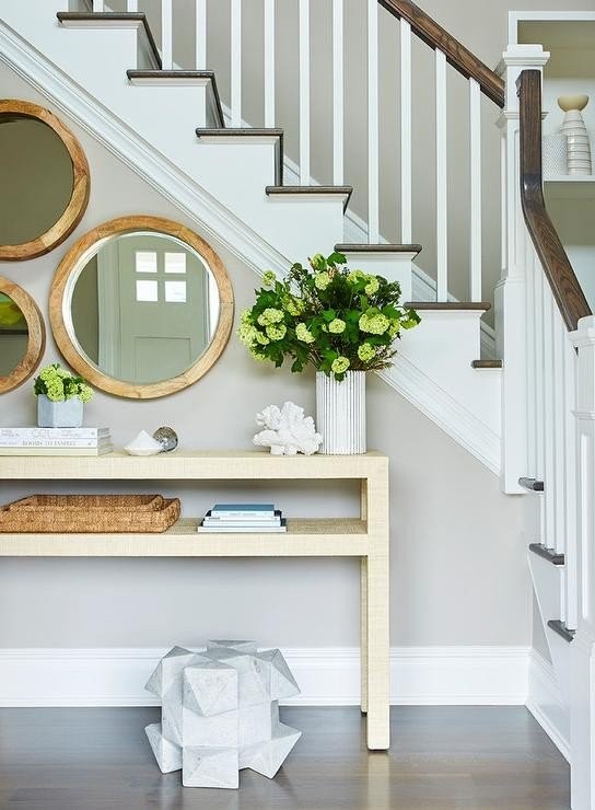 gold-raffia-console-table-with-staggered-mirrors.jpg