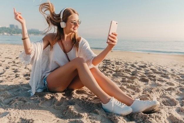 young-attractive-blond-smiling-woman-taking-selfie-photo-phone-vacation-sitting-beach-285396-7637.jpg