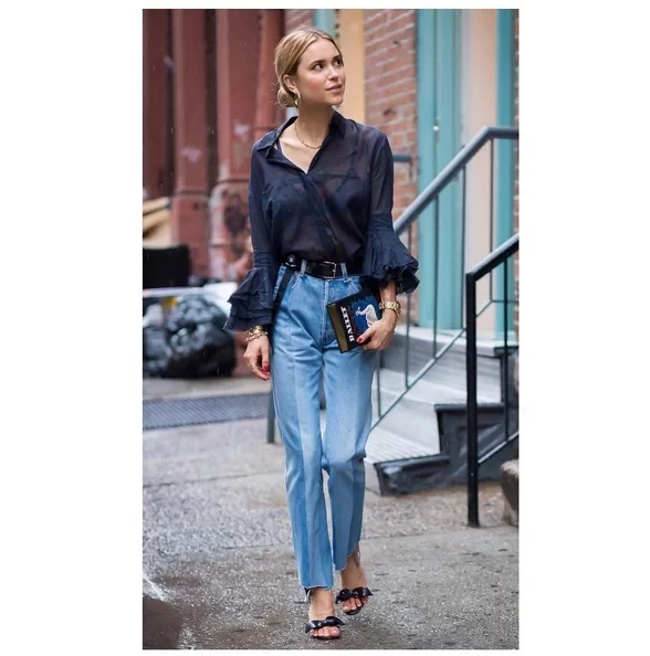 ruffle-sleeved-blouse-straight-leg-high-waisted-jeans-statement-accessories.webp